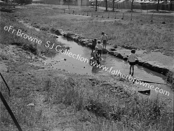 CHILDREN FISHING FOR PINKEENS  NEAR RACE COURSE